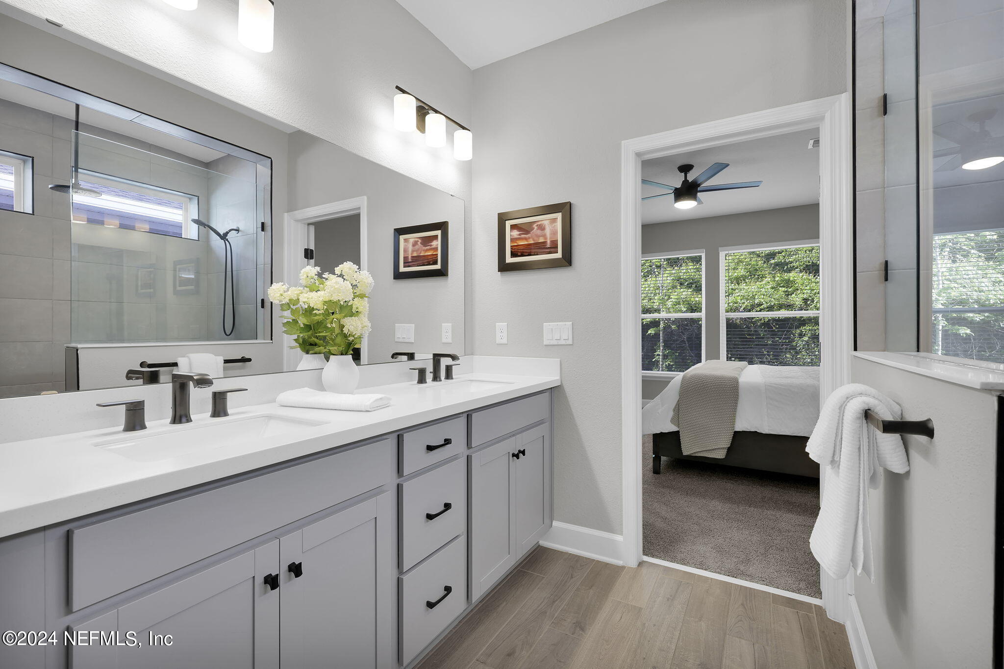 175 Windswept Way Street St. Augustine, FL 32092 - Photo 19 of 80 a en suite spacious bathroom with a granite countertop double vanity sink a mirror and a shower