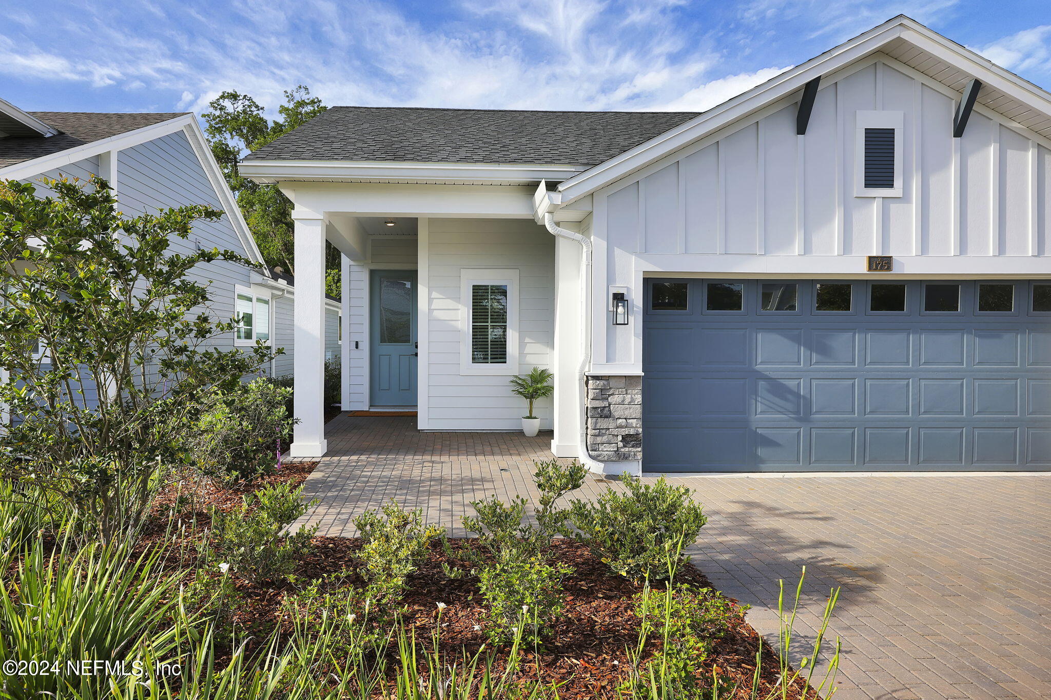 175 Windswept Way Street St. Augustine, FL 32092 - Photo 2 of 80 a front view of a house with garden