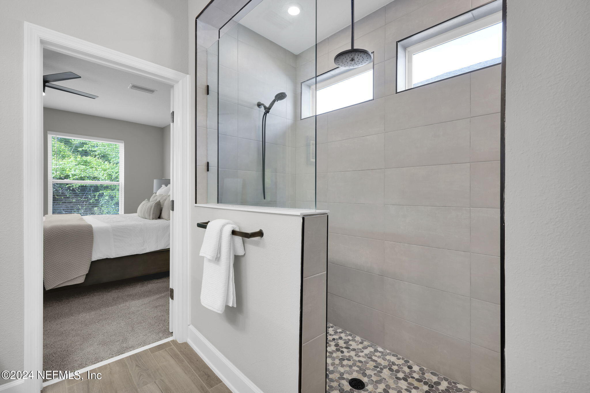 175 Windswept Way Street St. Augustine, FL 32092 - Photo 20 of 80 a bathroom with a bathtub and a shower