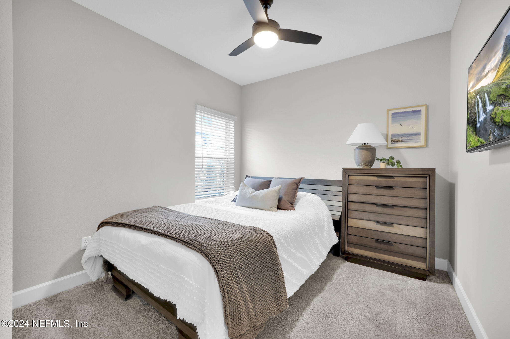 175 Windswept Way Street St. Augustine, FL 32092 - Photo 22 of 80 a bedroom with a bed and a chandelier