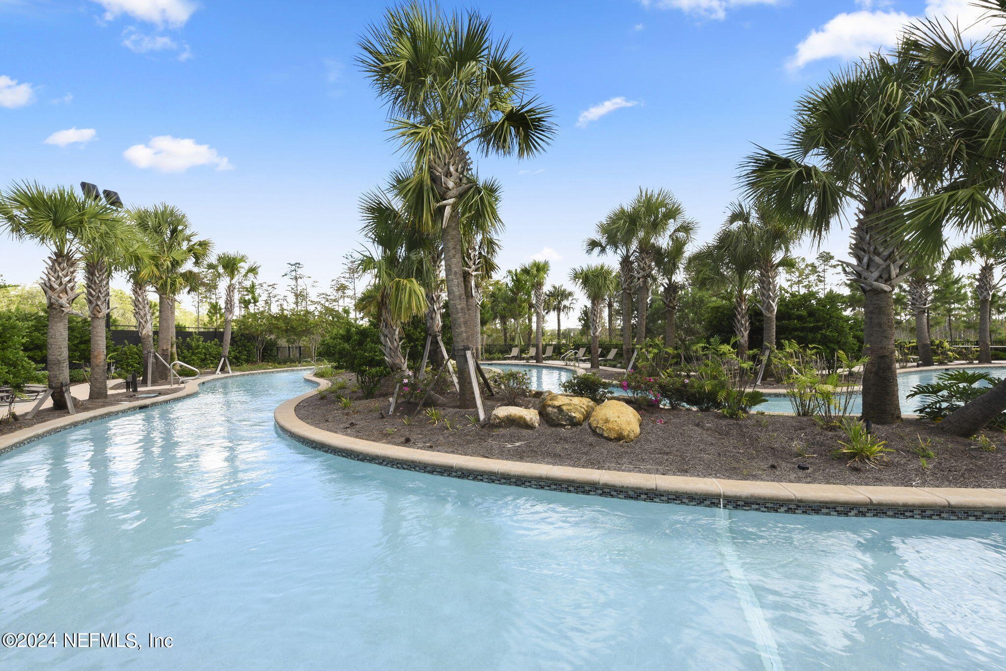 175 Windswept Way Street St. Augustine, FL 32092 - Photo 50 of 80 a swimming pool with outdoor seating and yard