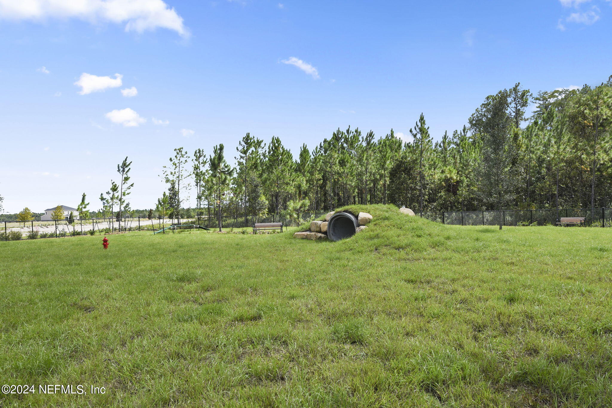 175 Windswept Way Street St. Augustine, FL 32092 - Photo 70 of 80 a backyard of a house with lots of green space and outdoor seating