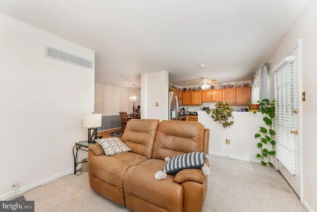 a kitchen with granite countertop a refrigerator stove and sink