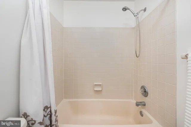 a view of a balcony with table and chairs