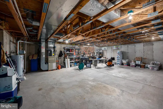 a front view of a house with a yard table and chairs