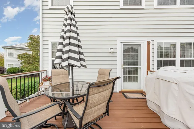 a view of a house with a big yard plants and large trees