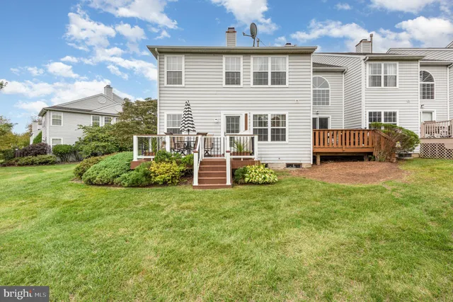 an aerial view of a house with garden space and street view