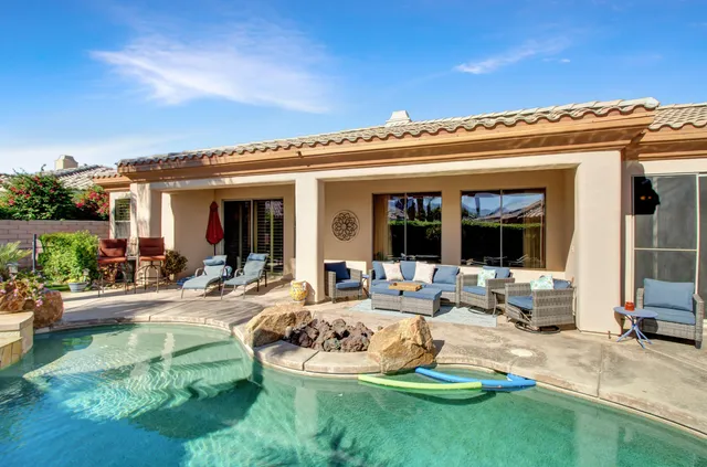a view of a house with backyard porch and patio