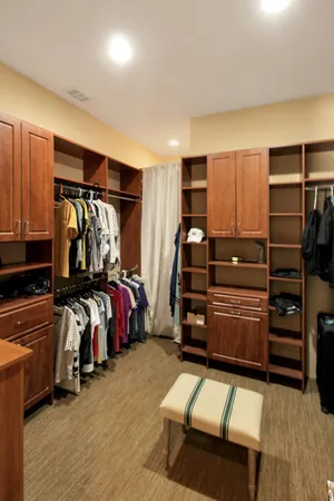 a bedroom with bed and a closet