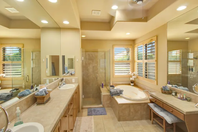 a bathroom with a double vanity sink and mirror