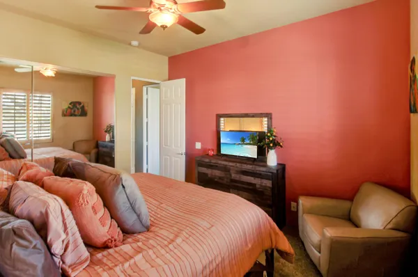 a bathroom with double vanity sinks and a mirror