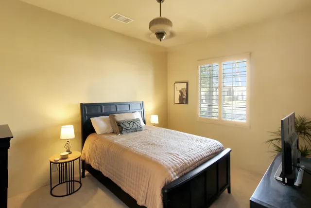 a bedroom with a bed and furniture