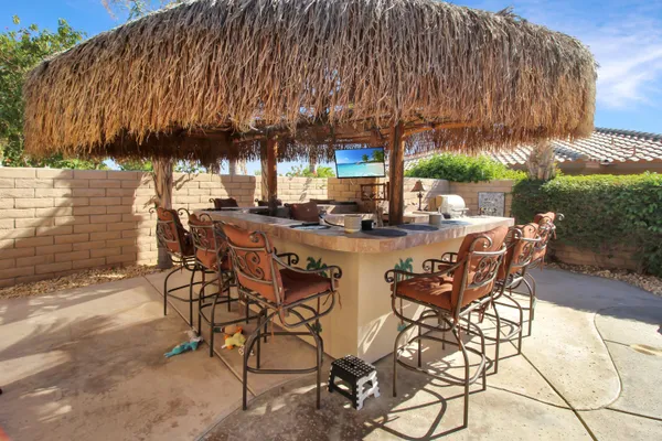 a view of a swimming pool with outdoor seating
