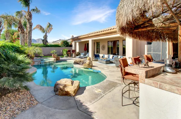 a view of a swimming pool with a patio
