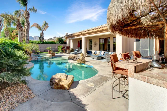a view of a swimming pool with a patio