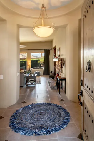 a living room with furniture and a dining table