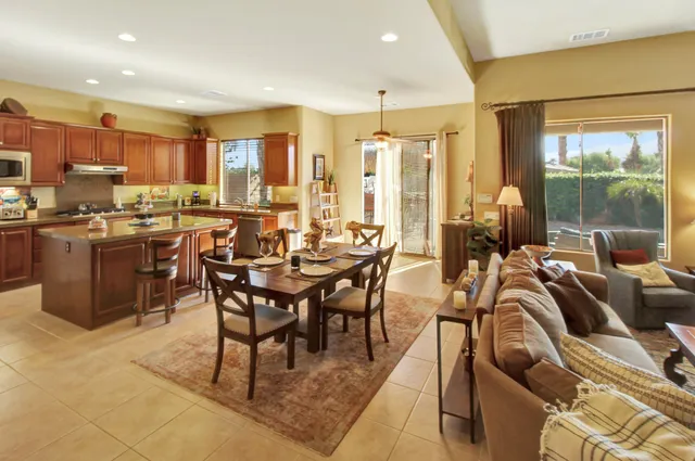 a view of a dining room with furniture window and outside view