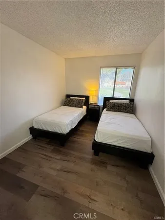 a bedroom with two beds and painted walls