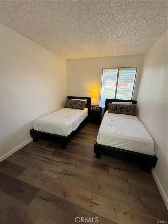 69520 Huerta Court Rancho Mirage, CA 92270 - Photo 13 of 25 a bedroom with two beds and painted walls