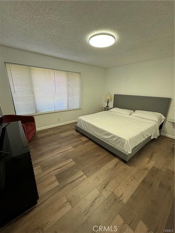 69520 Huerta Court Rancho Mirage, CA 92270 - Photo 14 of 25 a bedroom with a bed and a night stand