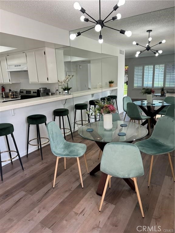 69520 Huerta Court Rancho Mirage, CA 92270 - Photo 3 of 25 a kitchen with a dining table chairs and view kitchen