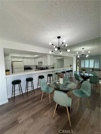 a large kitchen with a table and chairs