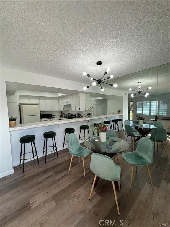69520 Huerta Court Rancho Mirage, CA 92270 - Photo 8 of 25 a large kitchen with a table and chairs