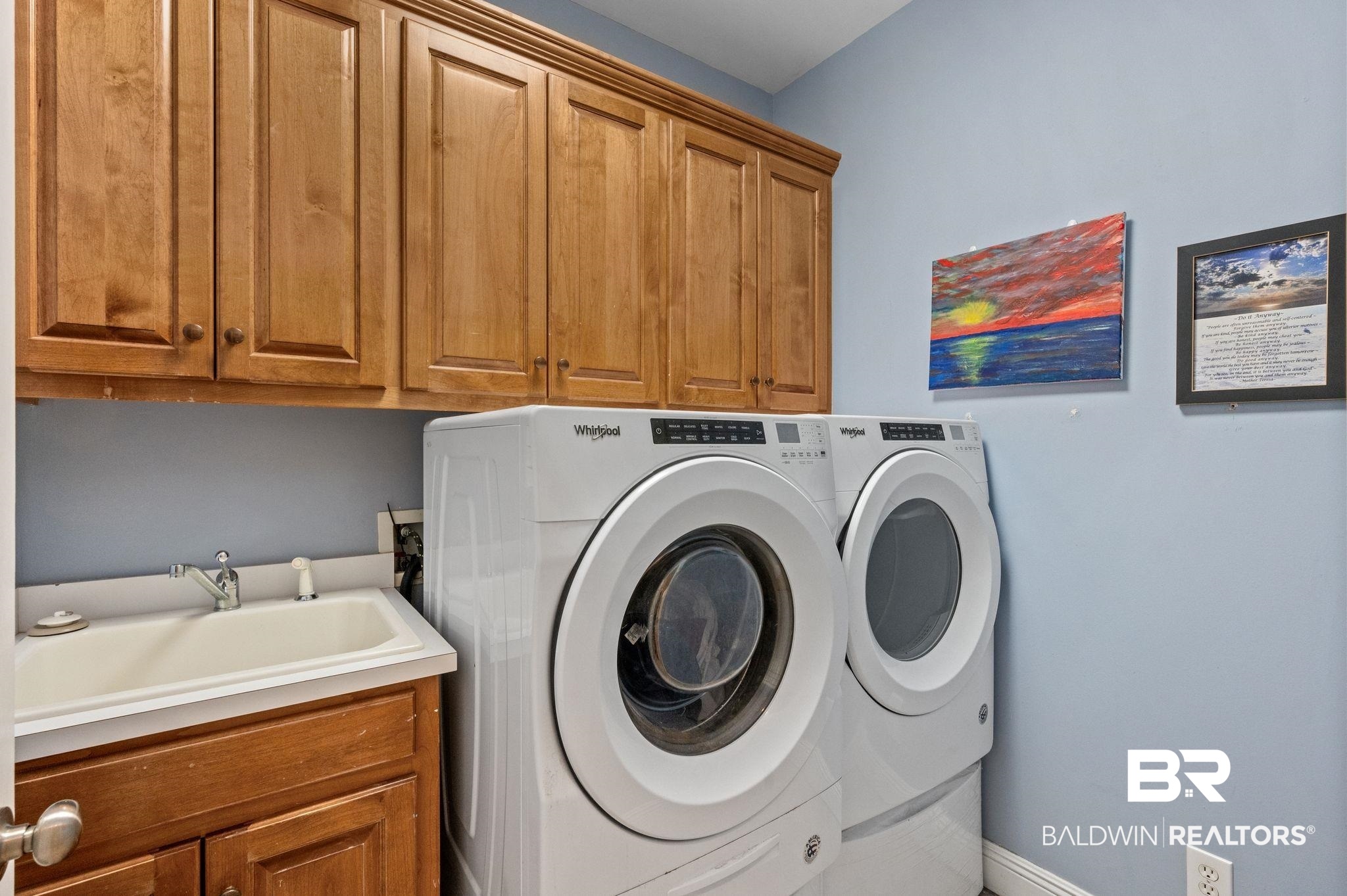 30151 Dolive Ridge Daphne, AL 36527 - Photo 23 of 37 Laundry room with washing machine and dryer, cabinet space, baseboards, and a sink