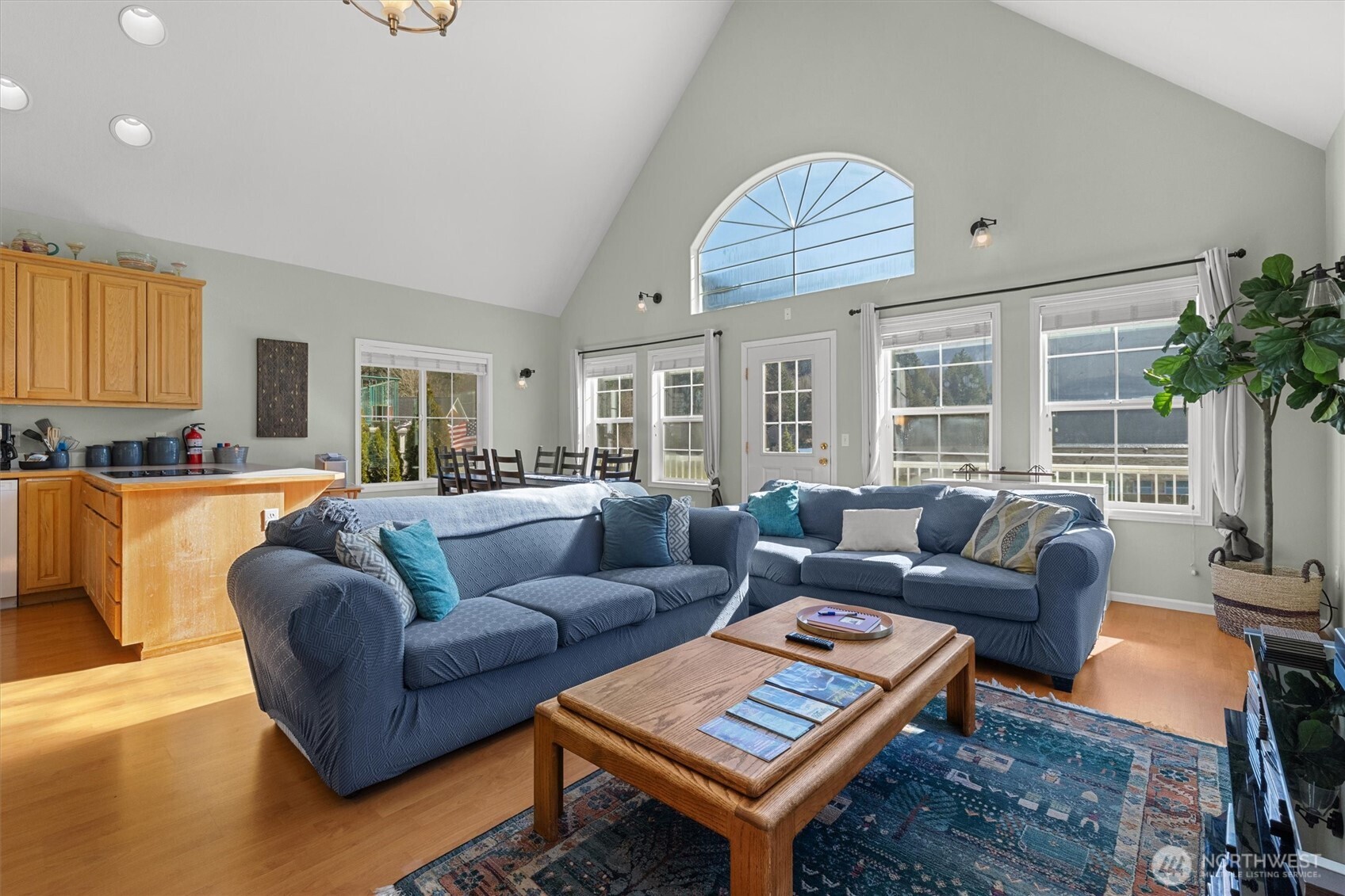 481 Maple Grove Road Port Angeles, WA 98363 - Photo 13 of 40 a living room with furniture a large window and a dining table