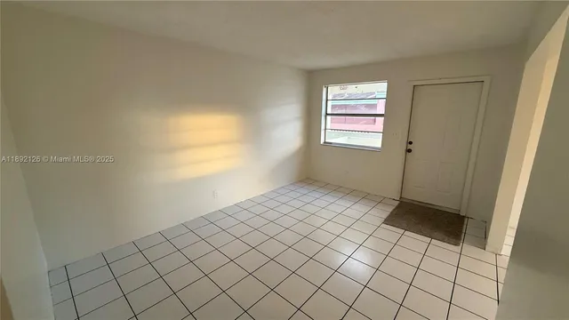 a view of an empty room and window