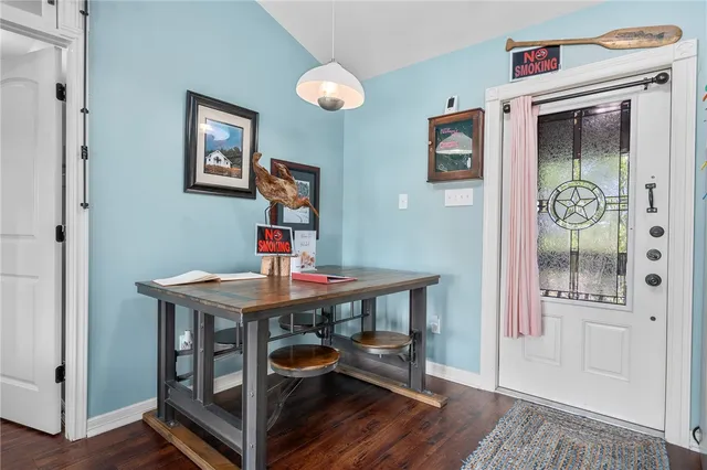 a living room with furniture fireplace and flat screen tv