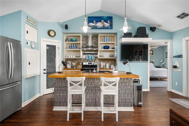 a kitchen with a stove and a sink