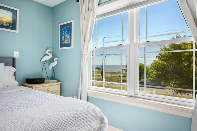 a spacious bathroom with a double vanity sink mirror and bathtub