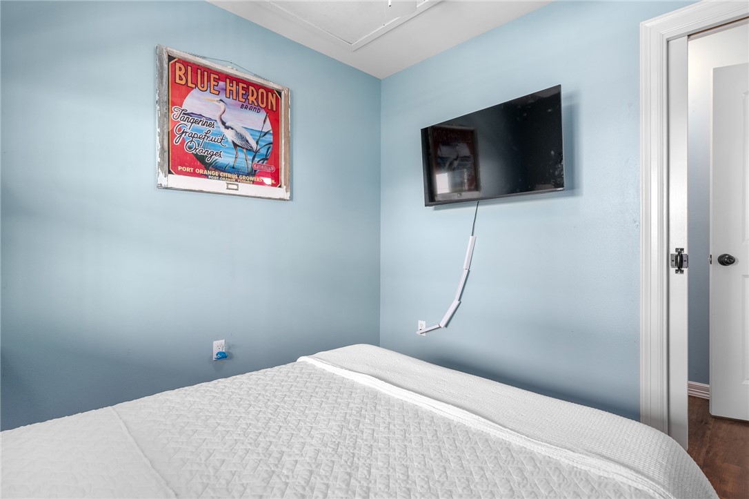 409 Copano Bay Drive Bayside, TX 78340 - Photo 30 of 37 a bedroom with a bed and a flat screen tv