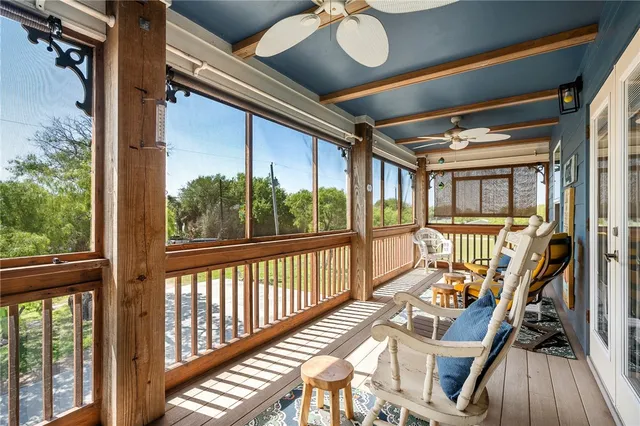 a view of a living room and balcony