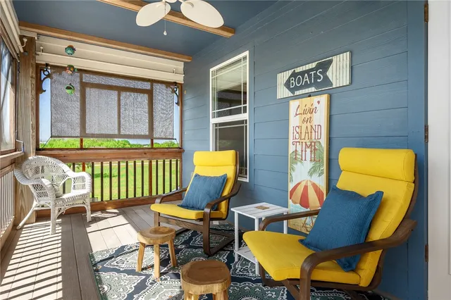 a view of a balcony with wooden floor