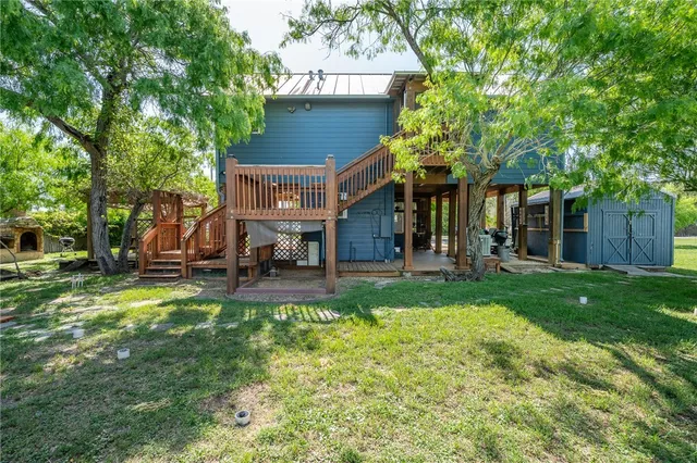a view of a house with a yard porch and sitting area