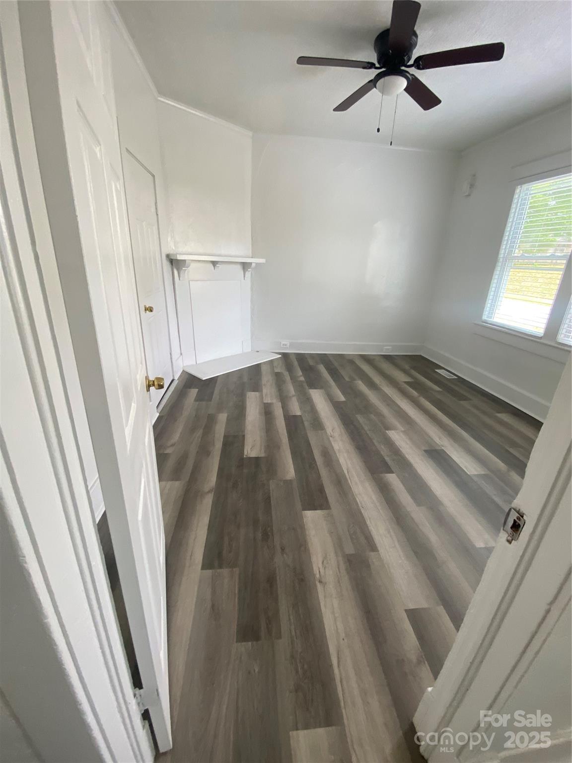 140 8th Street Winnsboro, SC 29180 - Photo 16 of 19 a view of a room with wooden floor