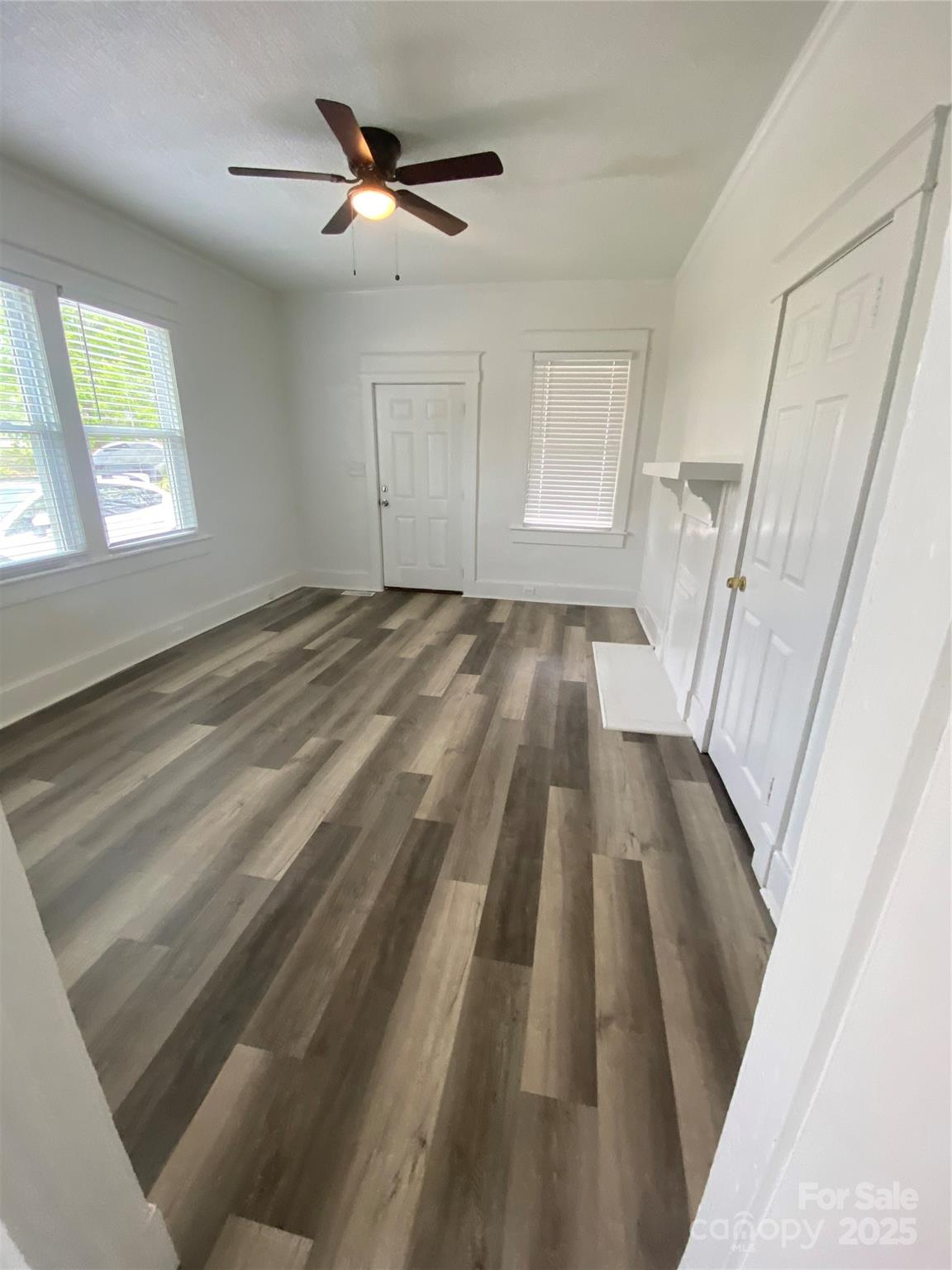 140 8th Street Winnsboro, SC 29180 - Photo 17 of 19 a view of empty room with wooden floor and fan