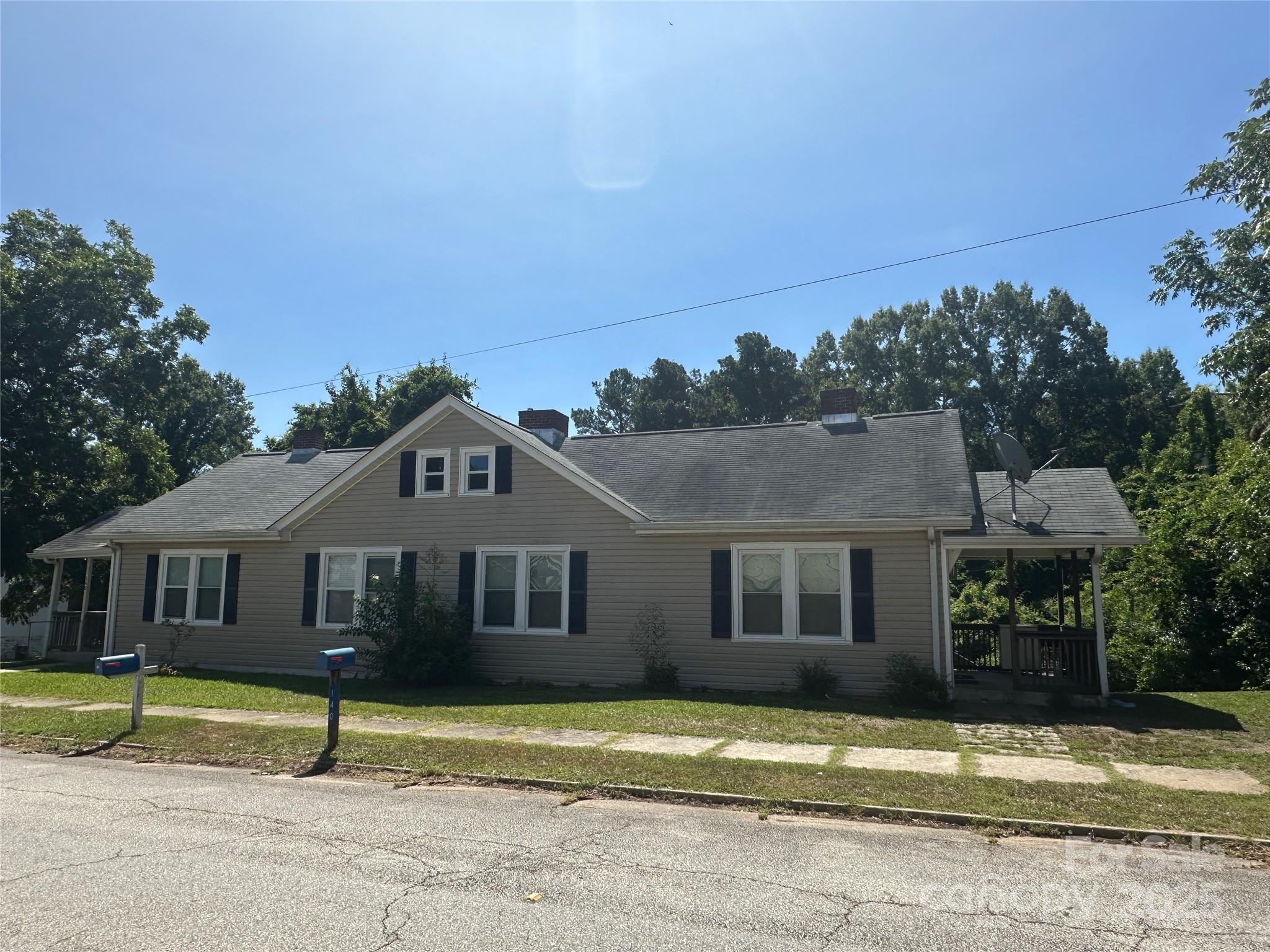 140 8th Street Winnsboro, SC 29180 - Photo 2 of 19 a front view of a house with a yard
