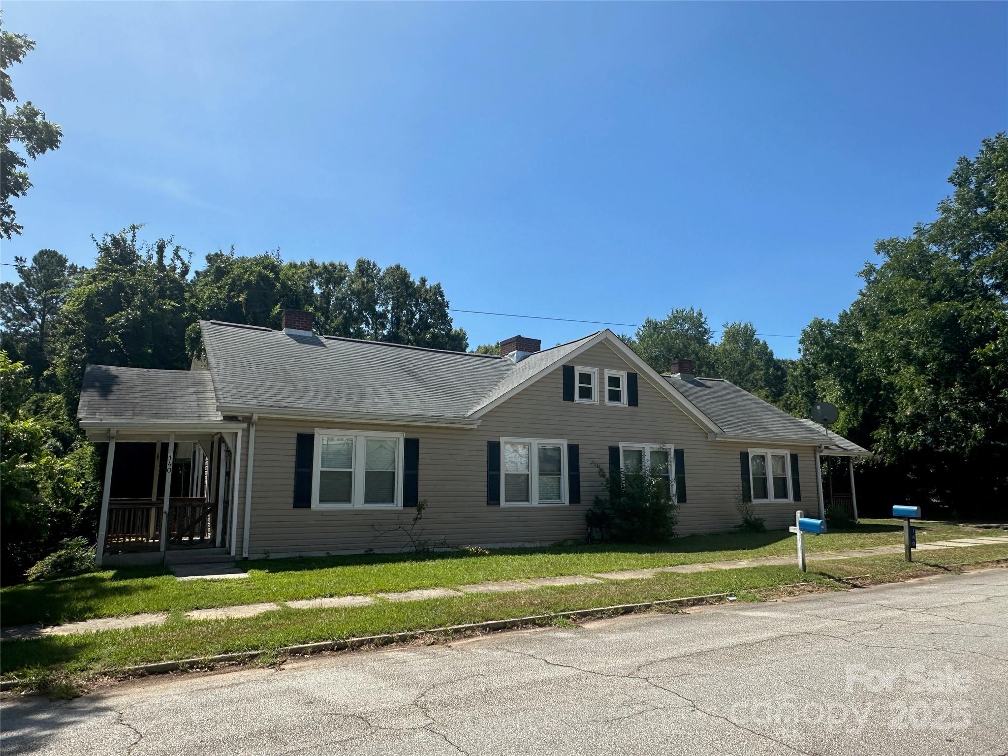 140 8th Street Winnsboro, SC 29180 - Photo 3 of 19 a front view of a house with a yard