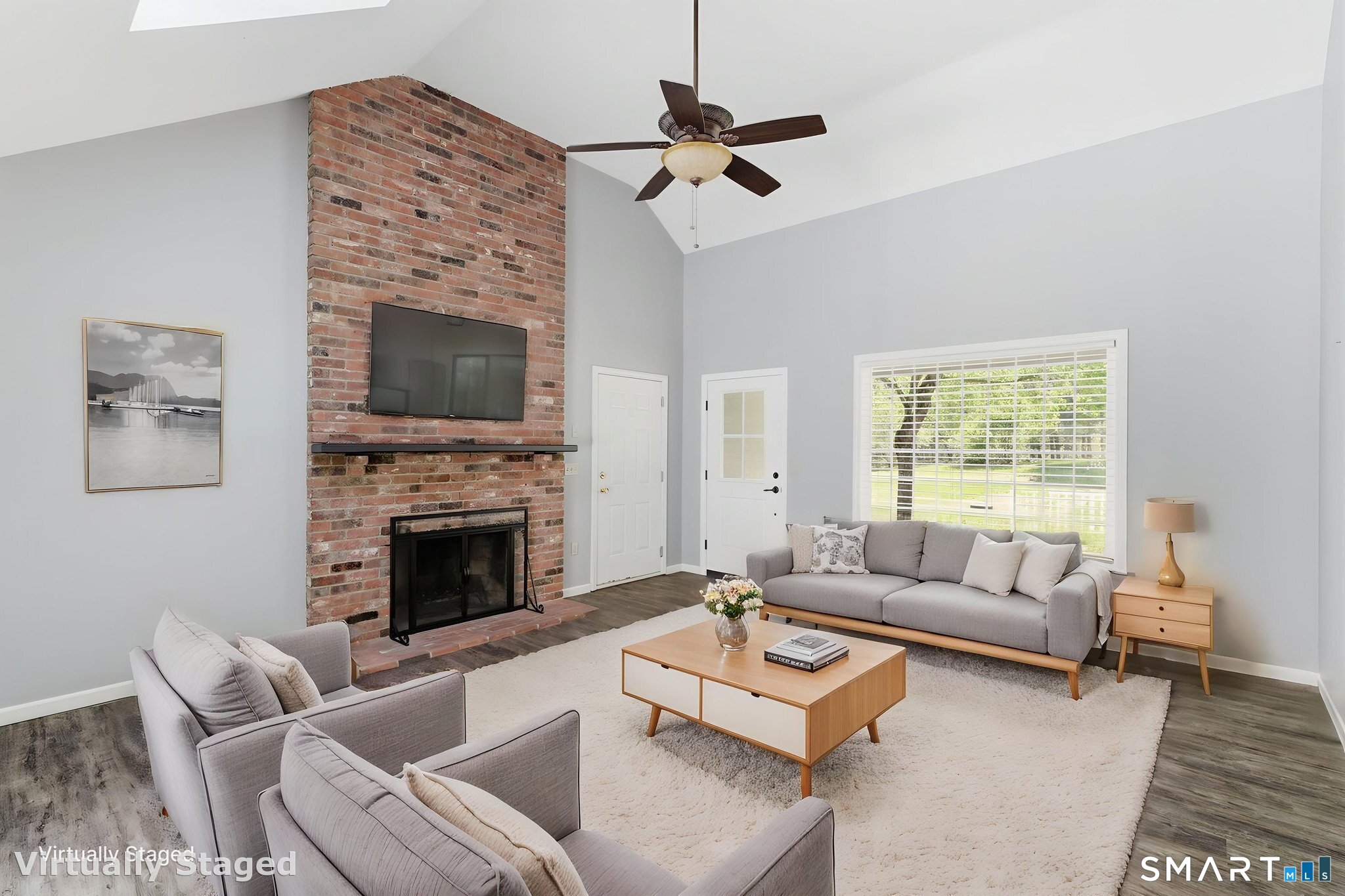 21 Greenwood Road North Granby, CT 06060 - Photo 16 of 40 a living room with furniture a flat screen tv and a fireplace