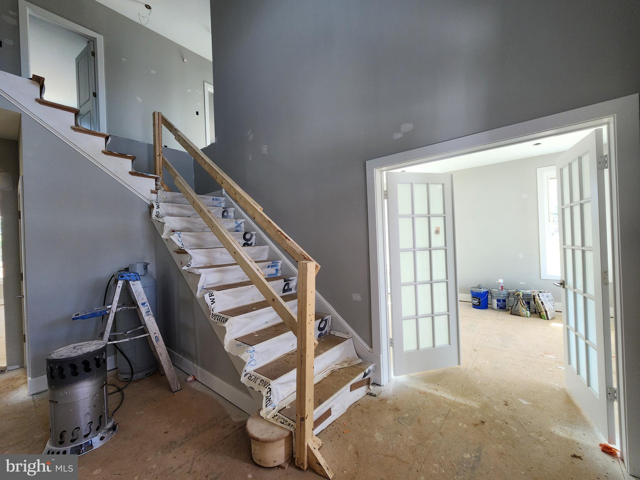 324 Bishop Hollow Road Newtown Square, PA 19073 - Photo 3 of 22 a view of an empty room with stairs