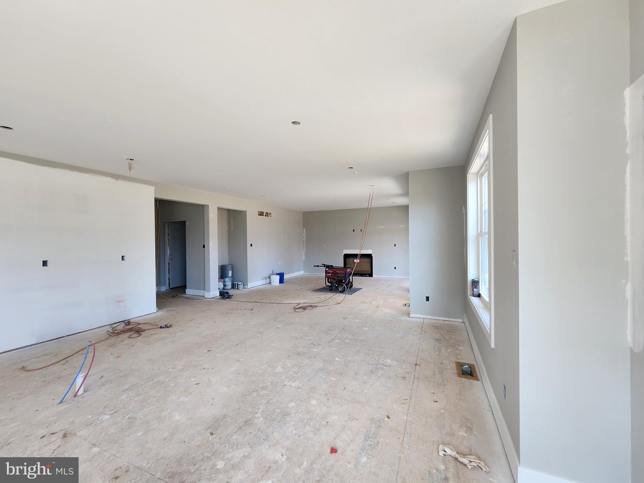 324 Bishop Hollow Road Newtown Square, PA 19073 - Photo 5 of 22 a view of a livingroom with a furniture and window