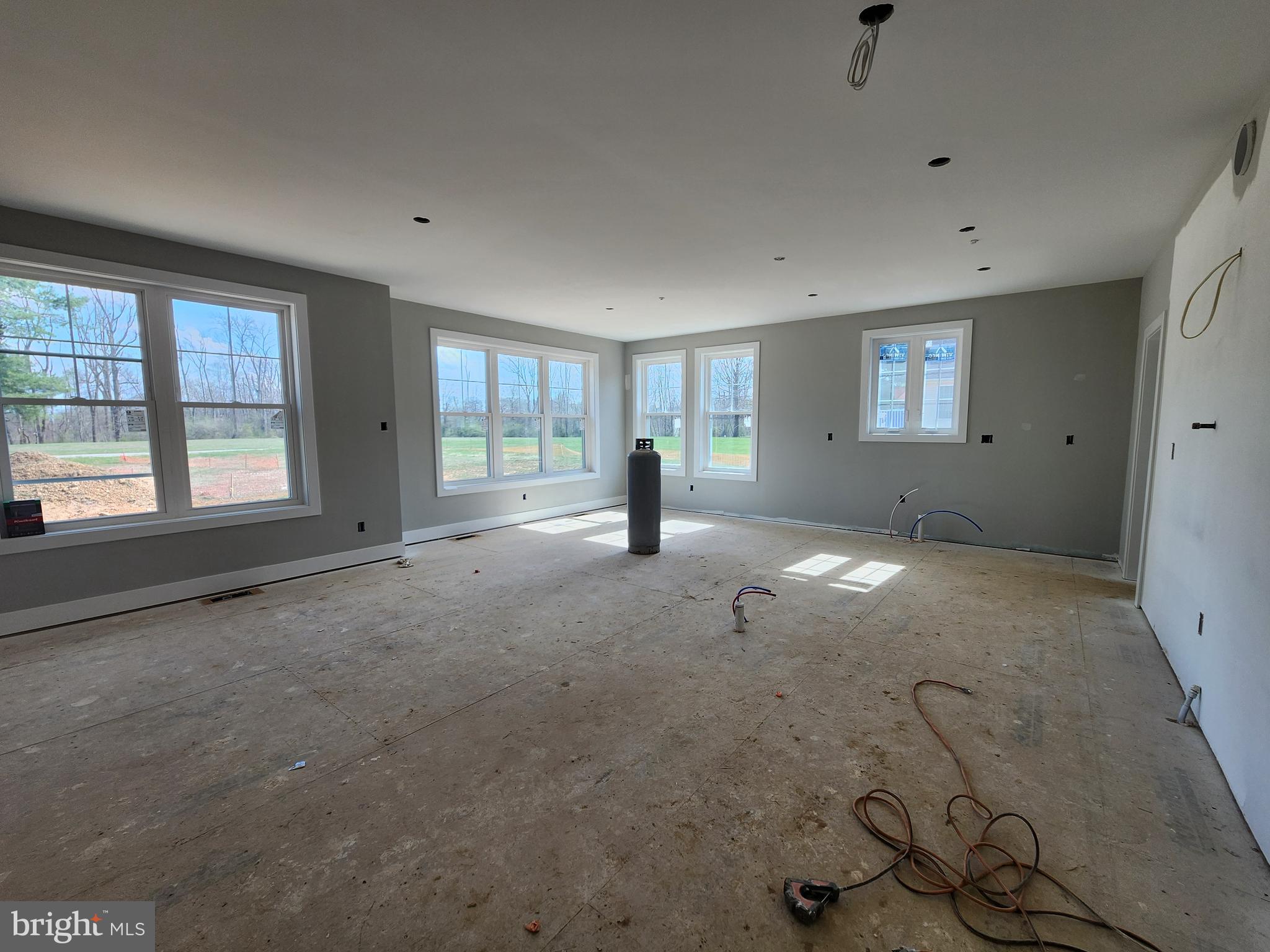 324 Bishop Hollow Road Newtown Square, PA 19073 - Photo 7 of 22 a view of an empty room with windows