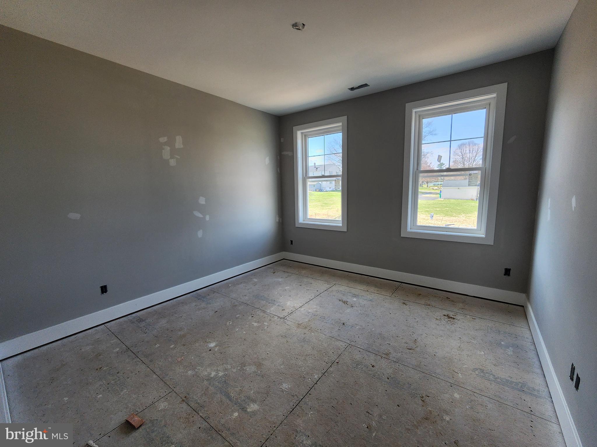 324 Bishop Hollow Road Newtown Square, PA 19073 - Photo 10 of 22 a view of an empty room with windows
