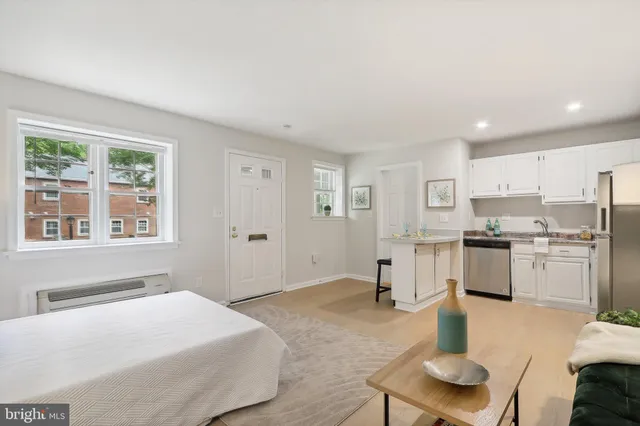 a spacious bedroom with a bed and furniture