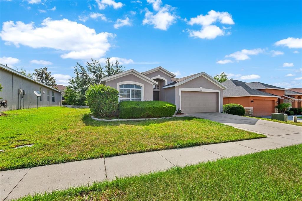 3483 Beaumont Loop Spring Hill, FL 34609 - Photo 14 of 14 a front view of house with yard and green space