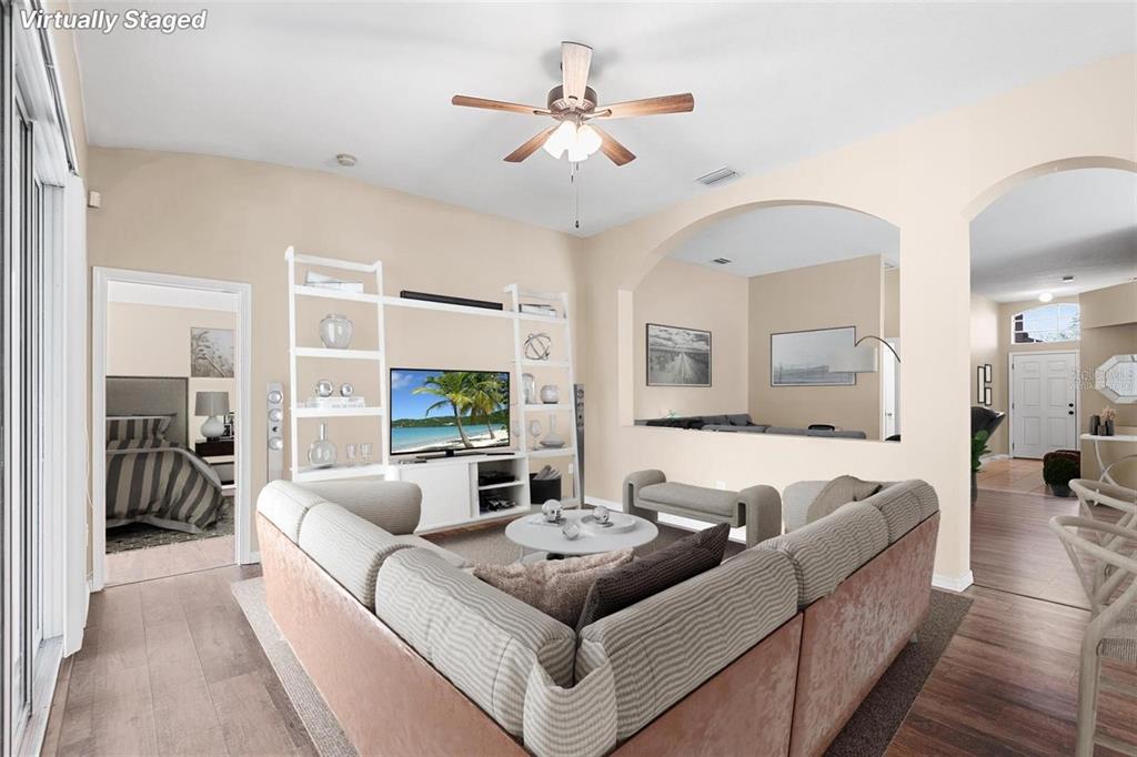 3483 Beaumont Loop Spring Hill, FL 34609 - Photo 2 of 14 a living room with furniture and a large window