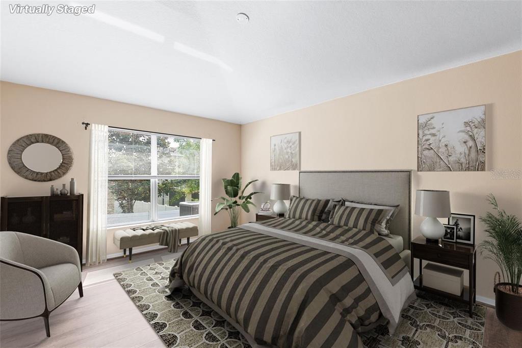 3483 Beaumont Loop Spring Hill, FL 34609 - Photo 7 of 14 a bedroom with bed and a large window with outer view